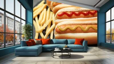 Delicious hot dogs and french fries on slate plate, closeup Wall mural