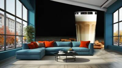 Delicious latte macchiato and cinnamon on grey table against black background, space for text Wall mural