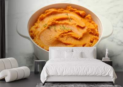 Delicious mashed sweet potatoes in pot on white marble table, closeup Wall mural