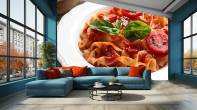 Delicious pasta with tomato sauce and basil on table, closeup Wall mural