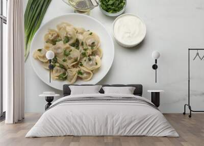 Delicious pelmeni with green onion served on white marble table, flat lay Wall mural