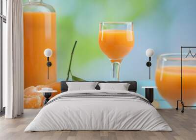 Delicious tangerine liqueur and fresh fruits on table Wall mural