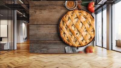 Delicious traditional apple pie on wooden table, flat lay. Space for text Wall mural