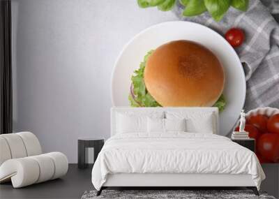 Delicious vegetarian burger with chickpea cutlet and ingredients on white table, flat lay. Space for text Wall mural