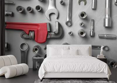 Different auto mechanic's tools on grey table, flat lay Wall mural