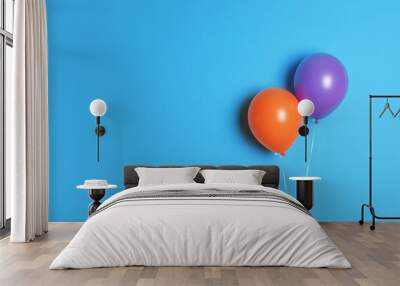 Different balloons on color background. Celebration time Wall mural