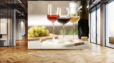 Different glasses with wine served on table Wall mural