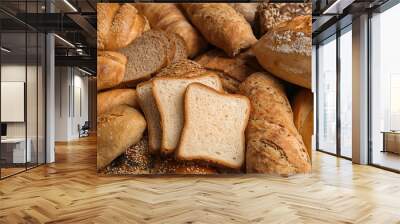 Different kinds of fresh bread as background, closeup Wall mural