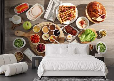 Different meals served for breakfast on wooden table, flat lay Wall mural