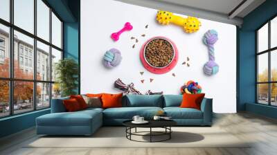 Different pet toys and feeding bowl on white background, top view Wall mural