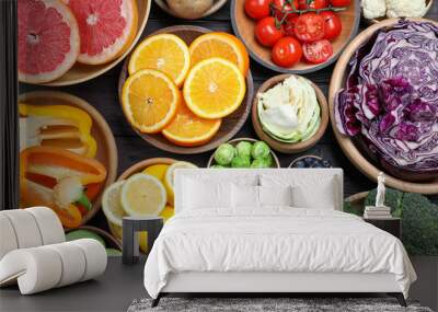 Different products rich in vitamin C on wooden table, flat lay Wall mural