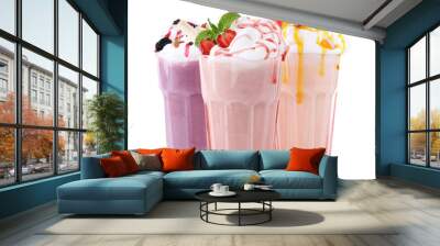 Different tasty milk shakes in glasses on white background Wall mural