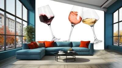 Different types of wine splashing in glasses on white background Wall mural