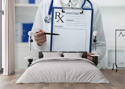 Doctor with blank prescription form in clinic, closeup Wall mural