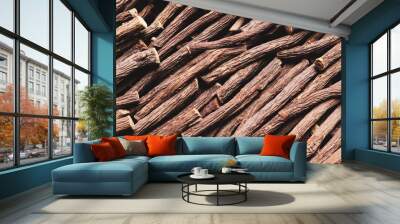 Dried sticks of liquorice root as background, top view Wall mural