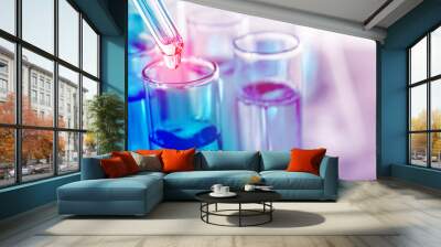 Dripping liquid from pipette into test tube on light background, banner design. Laboratory analysis Wall mural