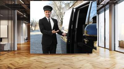 Driver opening door of luxury car. Chauffeur service Wall mural