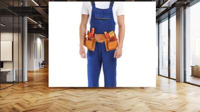 Electrician with tools wearing uniform on white background Wall mural