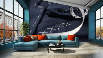 Elegant semi-ready jacket and measuring tape, closeup Wall mural