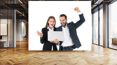 Emotional young people in office wear with laptop celebrating victory on white background Wall mural