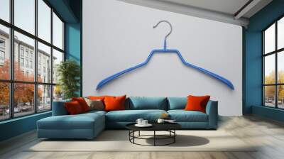 Empty clothes hanger on white background, top view Wall mural