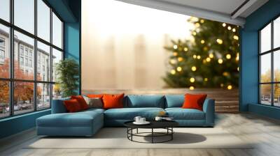 Empty table and blurred fir tree with yellow Christmas lights on background, bokeh effect. Space for design Wall mural