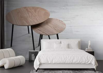 Empty wooden nesting tables indoors, space for text. Stylish furniture Wall mural