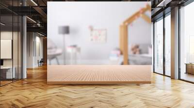 Empty wooden table in baby room interior Wall mural