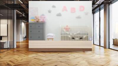 Empty wooden table in baby room. Space for text Wall mural