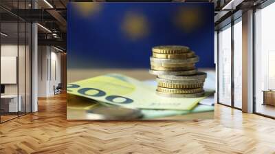 Euro banknotes and coins on table, closeup Wall mural