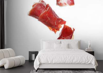 Falling delicious sliced jamon on white background Wall mural