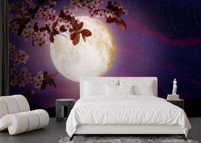 fantasy night. blossoming cherry tree branch and starry sky with full moon on background Wall mural