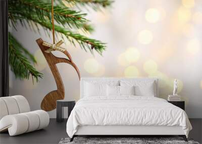 Fir tree branch with wooden note against blurred lights, space for text. Christmas music Wall mural