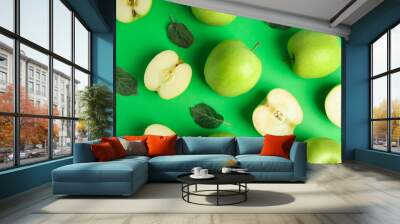 Flat lay composition of fresh ripe apples on green background Wall mural