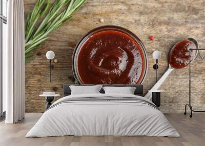 Flat lay composition with barbecue sauce on wooden background Wall mural