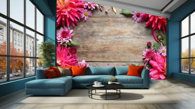 Flat lay composition with beautiful dahlia flowers and space for text on wooden background Wall mural