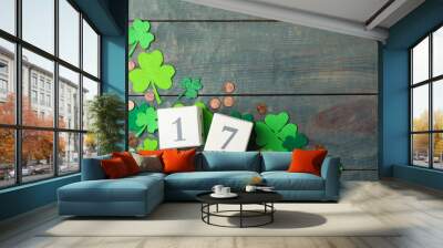 Flat lay composition with block calendar on blue wooden background, space for text. St. Patrick's Day celebration Wall mural