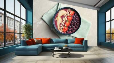 Flat lay composition with bowl of tasty acai smoothie on gray table Wall mural