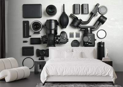 Flat lay composition with camera and video production equipment on light background Wall mural