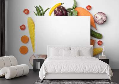 Flat lay composition with fresh vegetables and blank card for text on white background Wall mural