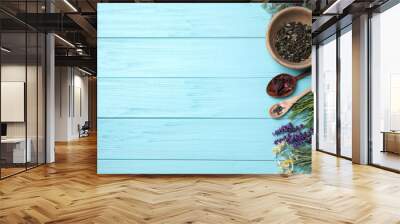 Flat lay composition with healing herbs on light blue wooden table. Space for text Wall mural