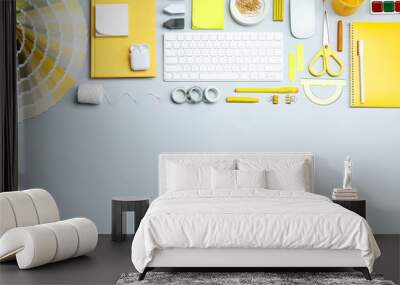 Flat lay composition with keyboard and stationery on light background, space for text. Designer's workplace Wall mural