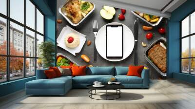 Flat lay composition with lunchboxes and smartphone on grey table, mockup for design. Healthy food delivery Wall mural