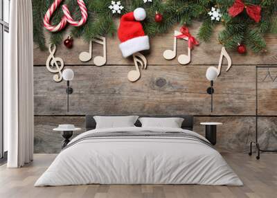 Flat lay composition with music notes on wooden background, space for text. Christmas celebration Wall mural