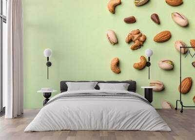 Flat lay composition with organic mixed nuts and space for text on color background Wall mural