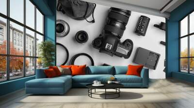 Flat lay composition with photographer's equipment and accessories on white background Wall mural