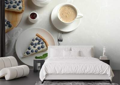 Flat lay composition with piece of tasty blueberry cake and space for text on gray table Wall mural