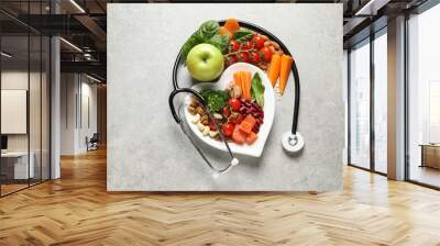 Flat lay composition with plate of products for heart-healthy diet on grey background Wall mural