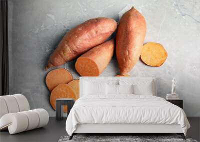 Flat lay composition with sweet potatoes on grey background Wall mural