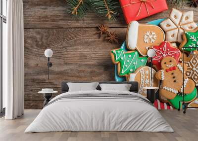 Flat lay composition with tasty homemade Christmas cookies on wooden table. Space for text Wall mural